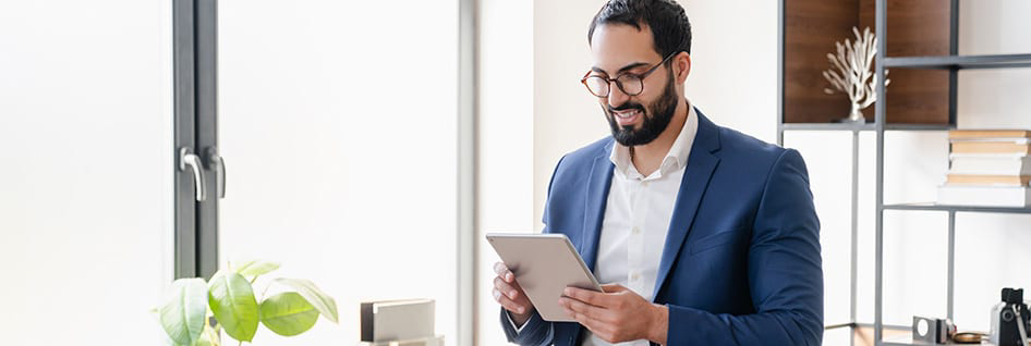 A man reading cloud-centric business model on the tablet.