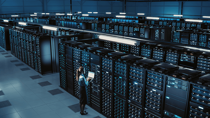 A sophisticated data centre with rows of servers, representing secure and scalable foundations designed by Bell's certified specialists.