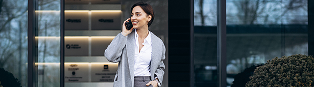 Female employee working while walking using a Microsoft Teams enabled smartphone.